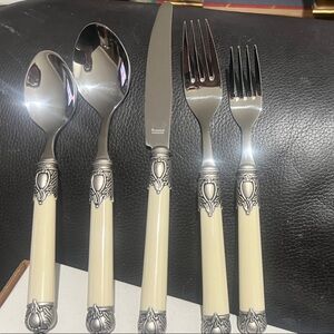 Elegant Cream and Silver Cutlery Set with an antique look.